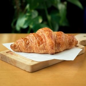 Golden butter croissant on a board