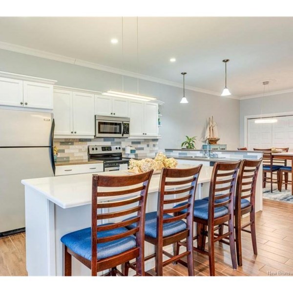 Open kitchen with a 7-foot quartz island