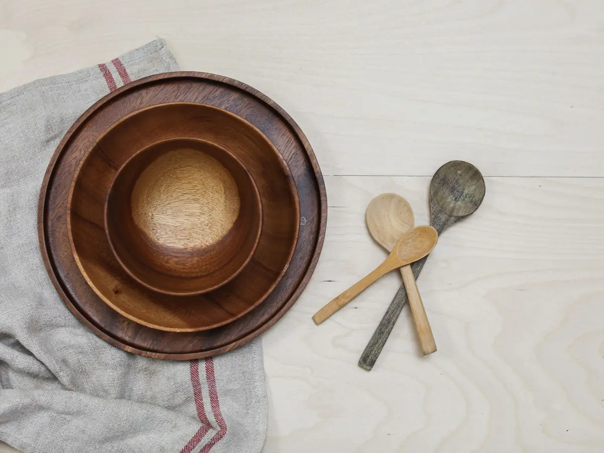 Wooden bowls and spoons on a kitchen table